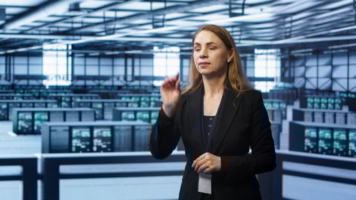 Portrait of young businesswoman standing in office