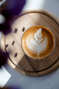 High angle view of cappuccino on table