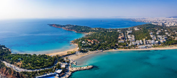 High angle view of sea and buildings against sky