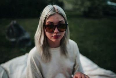 Portrait of young woman wearing sunglasses