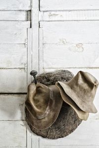 Close-up of old shoes hanging on wall