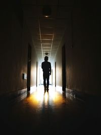 Silhouette of man in tunnel