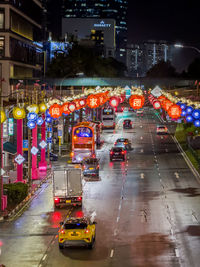 High angle view of traffic on city street at night