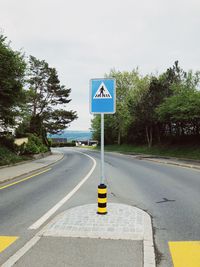 View of road sign against trees