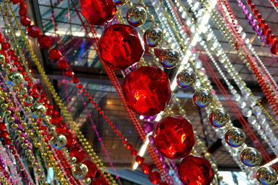 Low angle view of colorful beads hanging in the air