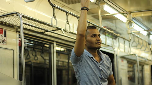 Portrait of young man looking away