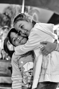 Portrait of girl embracing sister