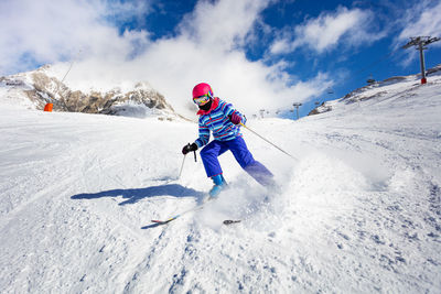 Man skiing on snow covered landscape