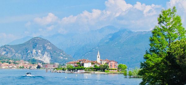 Panoramic view of buildings and mountains against sky