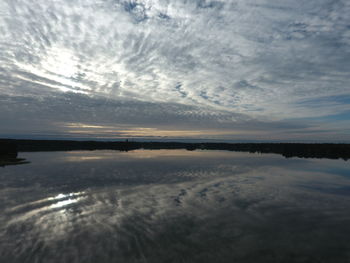Scenic view of calm sea against blue sky