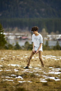 Rear view of man standing on field