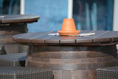 Wooden table and chairs at sidewalk cafe