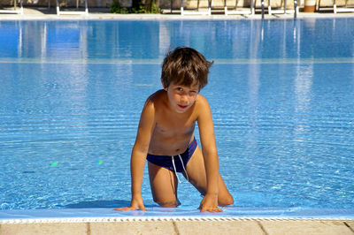 Portrait of happy boy in swimming pool