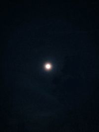 Low angle view of moon against sky at night