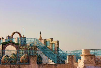 Low angle view of built structure against clear blue sky