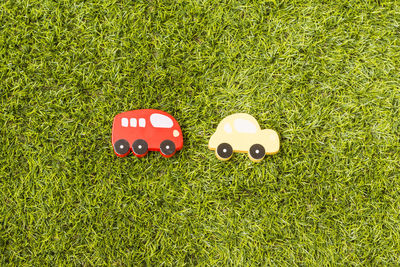 Directly above view of wooden cars on field