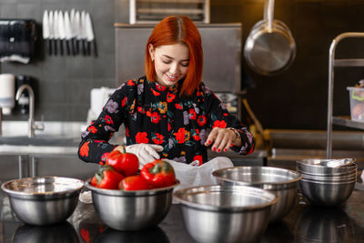 Woman holding food at home