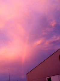 Low angle view of buildings against sky during sunset