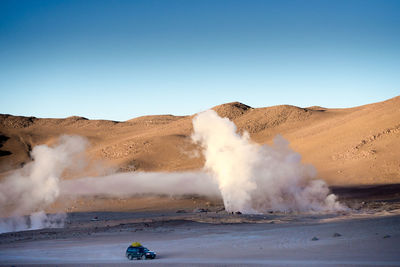 Scenic view of desert against clear sky