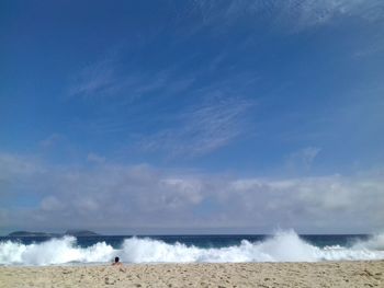 Scenic view of sea against blue sky