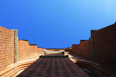 Low angle view of building against clear blue sky