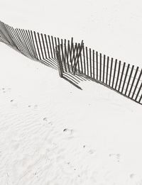 High angle view of railing on beach