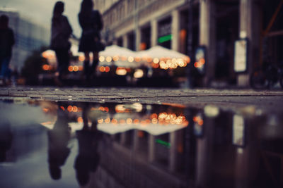 Puddle on footpath in city