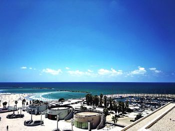 Scenic view of beach against blue sky