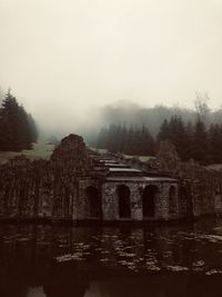 Bridge over river against sky