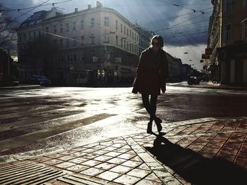 Woman standing on city street