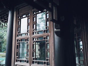 Close-up of pole against window