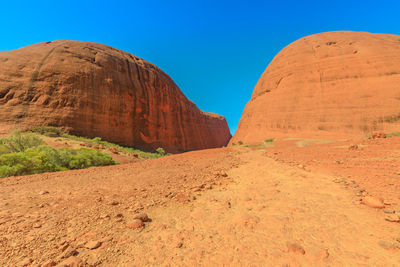 Rock formations in desert against clear sky