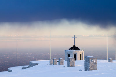 Building against sky during winter