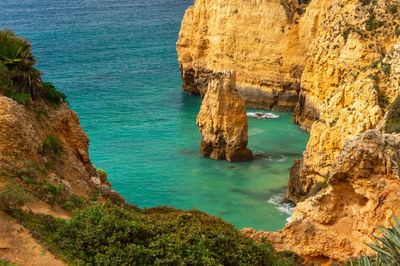 High angle view of rock formation in sea