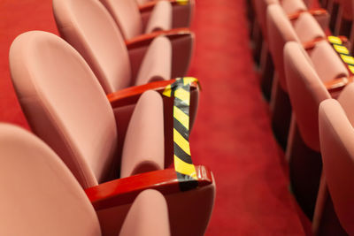 Close-up of empty seats in stadium