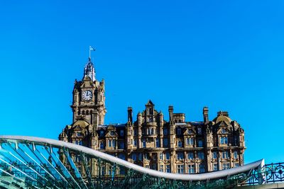 Low angle view of building against blue sky