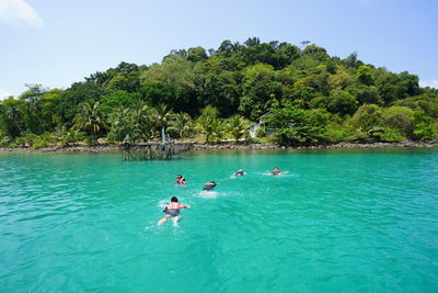 People swimming in sea