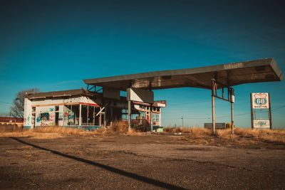 Abandoned train against blue sky