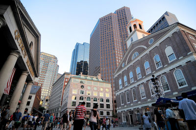 Low angle view of buildings in city against sky