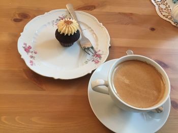 High angle view of coffee in cup on table