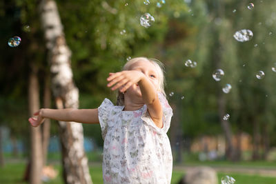 Full length of woman with bubbles