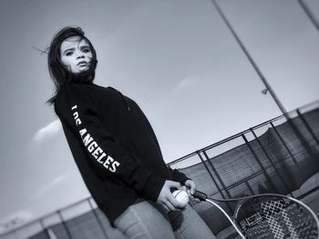 Low angle view of woman against sky