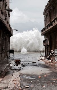 Explosive sea waves against buildings