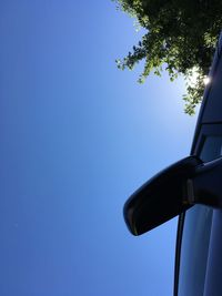 Low angle view of tree against clear blue sky