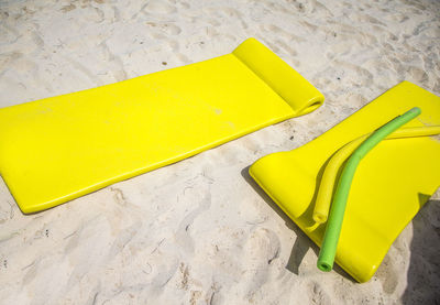 High angle view of yellow inflatable at beach