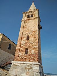 Low angle view of historic building against sky