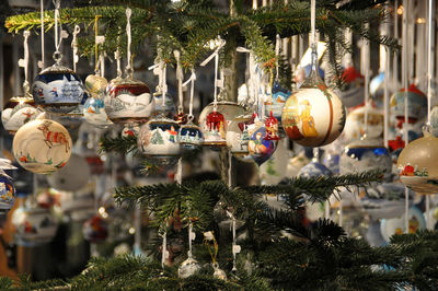 Christmas decorations hanging on tree