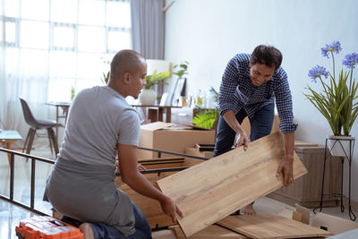 Side view of man working at home