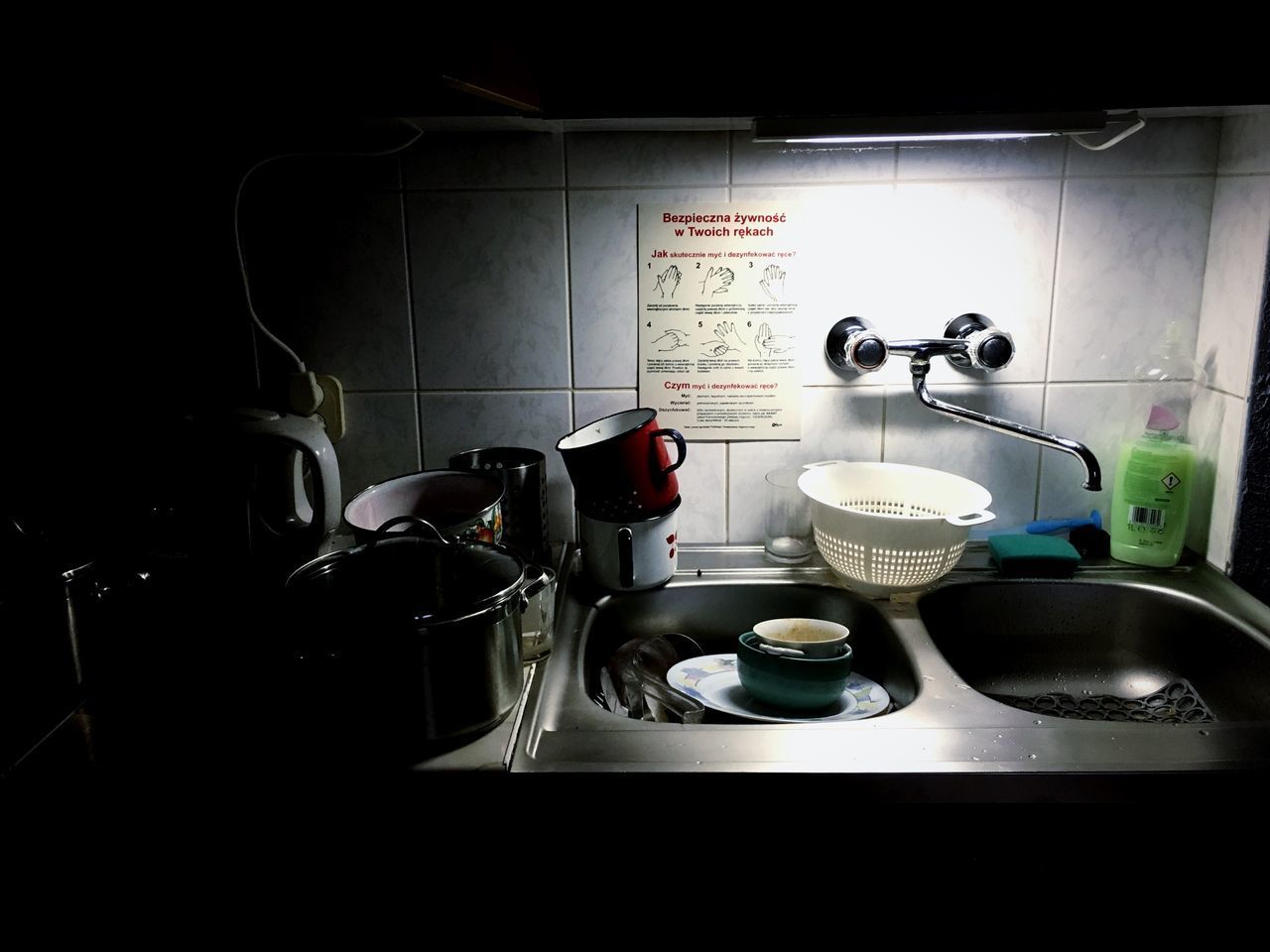 CLOSE-UP OF COFFEE CUP ON TABLE WITH KITCHEN