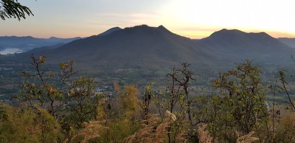 Scenic view of mountains against sky during sunset